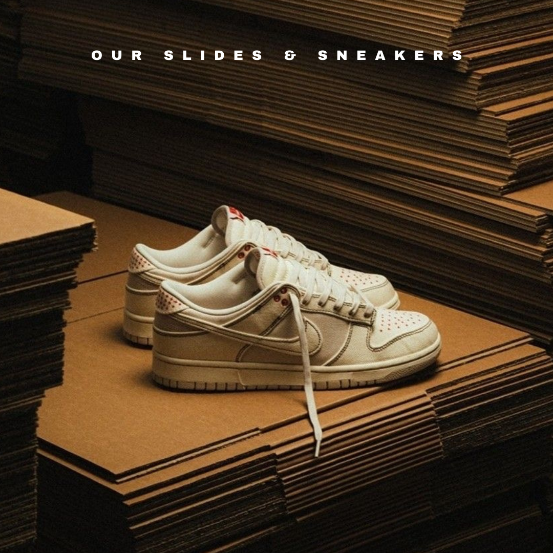 White sneakers on stacked cardboard boxes with text our slides and sneakers