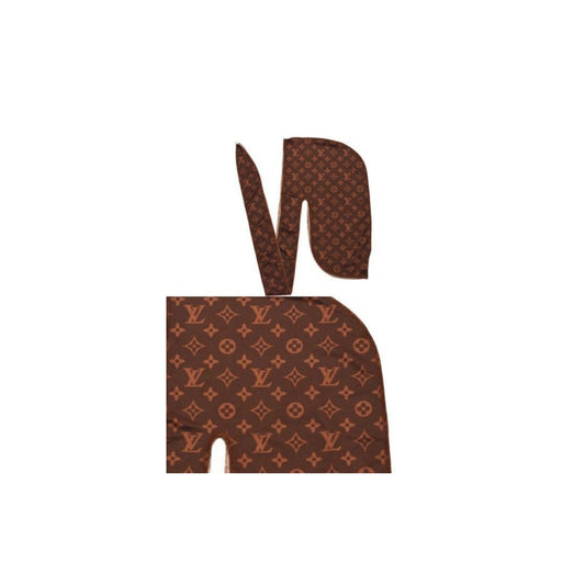 Brown elephant silhouette with Louis Vuitton monogram pattern on white background